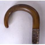 A GOOD LATE 19TH CENTURY VICTORIAN RHINOCEROS HORN HANDLED WALKING CANE, formed with a white metal