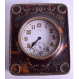 AN ANTIQUE TORTOISESHELL PIQUE INLAID TRAVELLING CLOCK with enamelled numerals. Watch 6 cm wide.