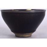 A CHINESE QING DYNASTY HARESFOOT POTTERY BOWL, formed with a silver rim. 12.5 cm wide.