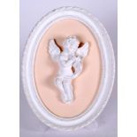 AN OVAL PLASTER PARIAN TYPE PLAQUE, depicting a cherub playing an instrument 20.5 cm x 15.5 cm.