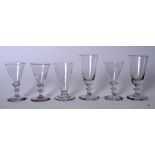 A GROUP OF SIX GEORGIAN GLASSES, varying size. Largest 14 cm high. (6)