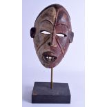 AN EARLY 20TH CENTURY AFRICAN TRIBAL POLYCHROMED MASK. 29 cm x 17 cm.