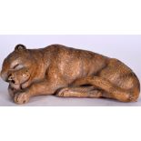 AN EARLY 20TH CENTURY EUROPEAN POTTERY FIGURINE OF A SLEEPING LION, modelled with eyes closed.13 cm