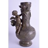 A 19TH CENTURY FRENCH SPELTER VASE overlaid with a cherub. 31 cm high.