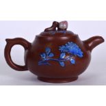 A CHINESE YIXING OR ZISHA POTTERY TEA POT, enamelled with blue foliage, signed. 18 cm wide.