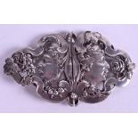 A PAIR OF SOLID SILVER EUROPEAN ART NOUVEAU BUCKLES, forming portraits opposing fruiting vines. 4.7