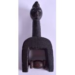 AN AFRICAN TRIBAL LACQUERED WOOD PULLEY. 15 cm x 8 cm.