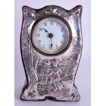 A CHARMING ART NOUVEAU ENGLISH SILVER MANTEL CLOCK decorated with two figures upon a stump. 15 cm x