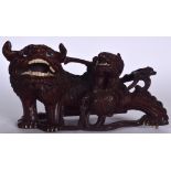 A CHINESE QING DYNASTY CARVED WOODEN STATUE OF A FOO DOG, modelled with with young upon its back. 3