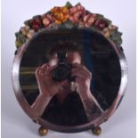 AN ANTIQUE PLASTER TOP FLORAL MIRROR, formed upon ball feet. 29 cm x 25 cm.