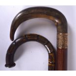 A 19TH CENTURY RHINOCEROS HORN HANDLED WALKING CANE WITH YELLOW METAL COLLAR, together with another