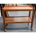 A ROBERT MOUSEMAN THOMPSON TWO TEIR OAK TEA TROLLEY, formed with square section supports and signat