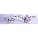 A PAIR OF 18TH CENTURY CHINESE EXPORT FAMILLE ROSE SAUCEBOATS Qianlong, painted with foliage. 26 cm