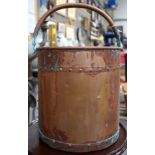 AN ANTIQUE COPPER BUCKET, formed with stud work decoration. 44 cm to handle.