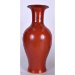 A LARGE 20TH CENTURY CHINESE RED GLAZED PORCELAIN BALUSTER VASE, bearing Kangxi marks to base. 42 c