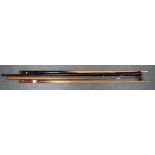 TWO VINTAGE SNOOKER CUE, one contained within a metal case, together with a rest. (4)
