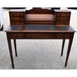 AN EARLY 20TH CENTURY MAHOGANY DESK,inset with leather panels on four tapering legs. 102 cm x 107 c