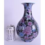 A 19TH CENTURY CHINESE FAMILLE ROSE YUHUCUMPING VASE bearing Qianlong marks to base, enamelled with