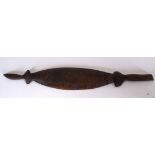 AN ANTIQUE AUSTRALIAN ABORIGINAL WOODEN WOOMERA OR SPEAR-THROWER, carved detail to body. 52.5 cm.