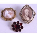 A GEORGIAN PASTE BROOCH, together with a Victorian cameo and mourning brooch. (3)