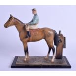 AN ART DECO COLD PAINTED SPELTER HORSE TABLE LIGHTER modelled as a jockey. 18 cm x 16 cm.