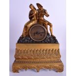 A 19TH CENTURY FRENCH BRONZE MANTEL CLOCK modelled as romantic figures upon an outcrop. 36 cm x 25