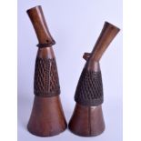 AN UNUSUAL PAIR OF TRIBAL CARVED ZIG ZAG HORNS. 29 cm & 26 cm high.