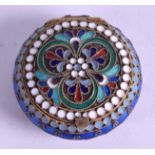 A RUSSIAN SILVER GILT ENAMEL PILL BOX, decorated with stylised foliage. 4.4 cm wide.