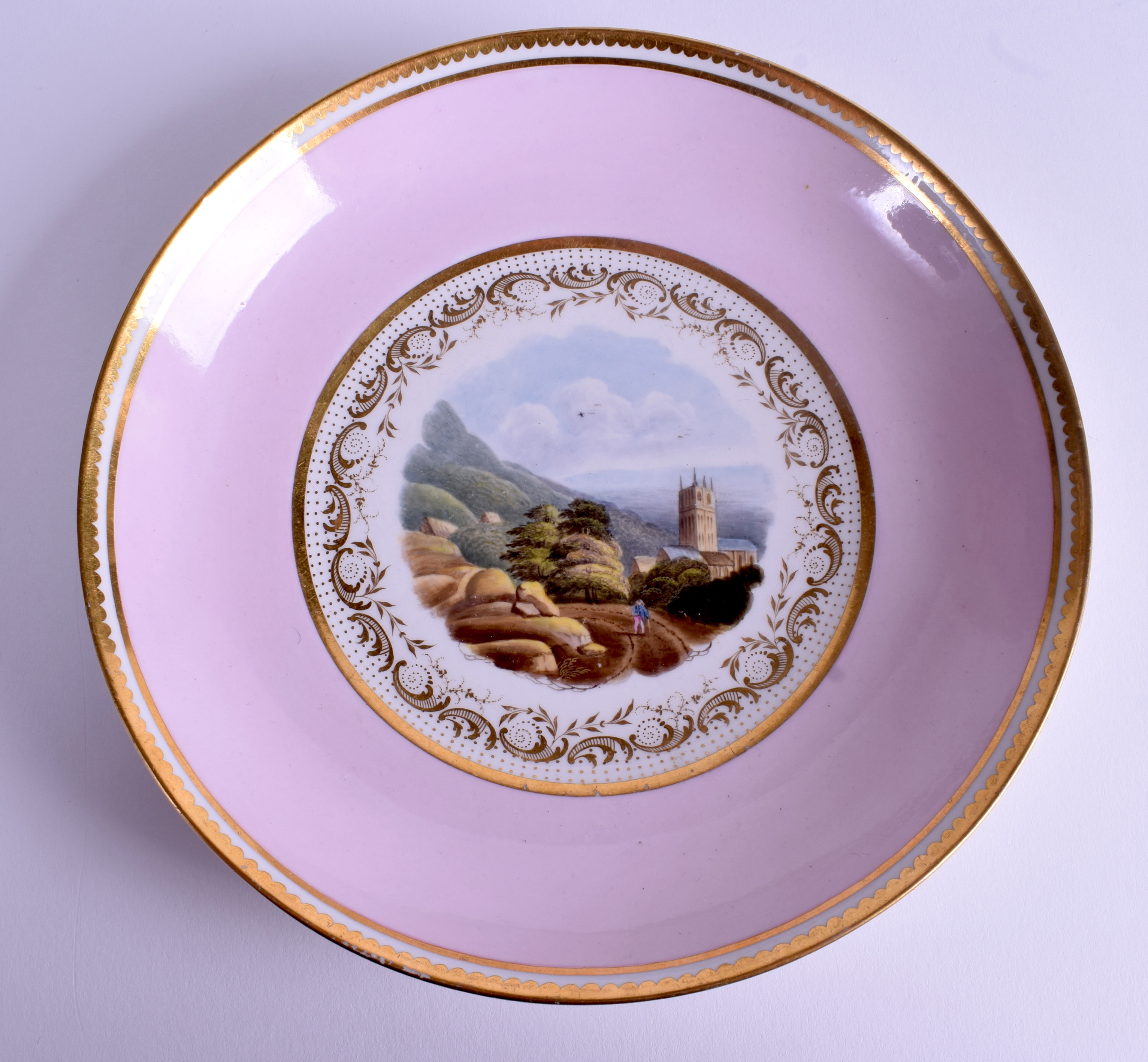 AN EARLY 19TH CENTURY FLIGHT BARR AND BARR SAUCER painted with Malvern Church, Worcestershire. 19 c