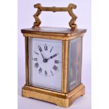 A SMALL EARLY 20TH CENTURY FRENCH BRASS CARRIAGE CLOCK. 12.5 cm high inc handle.