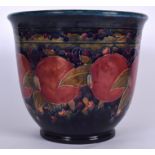 A LARGE EARLY 20TH CENTURY MOORCROFT POTTERY JARDINIERE, painted with fruiting vines, circa 1918. 2