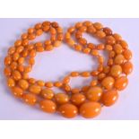 A GOOD DOUBLE STRAND AMBER NECKLACE. 77 cm long & weight 177 grams.