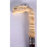 A GOOD 19TH CENTURY CHINESE CANTON IVORY WALKING STICK, carved in the form of a dragon. 88 cm.