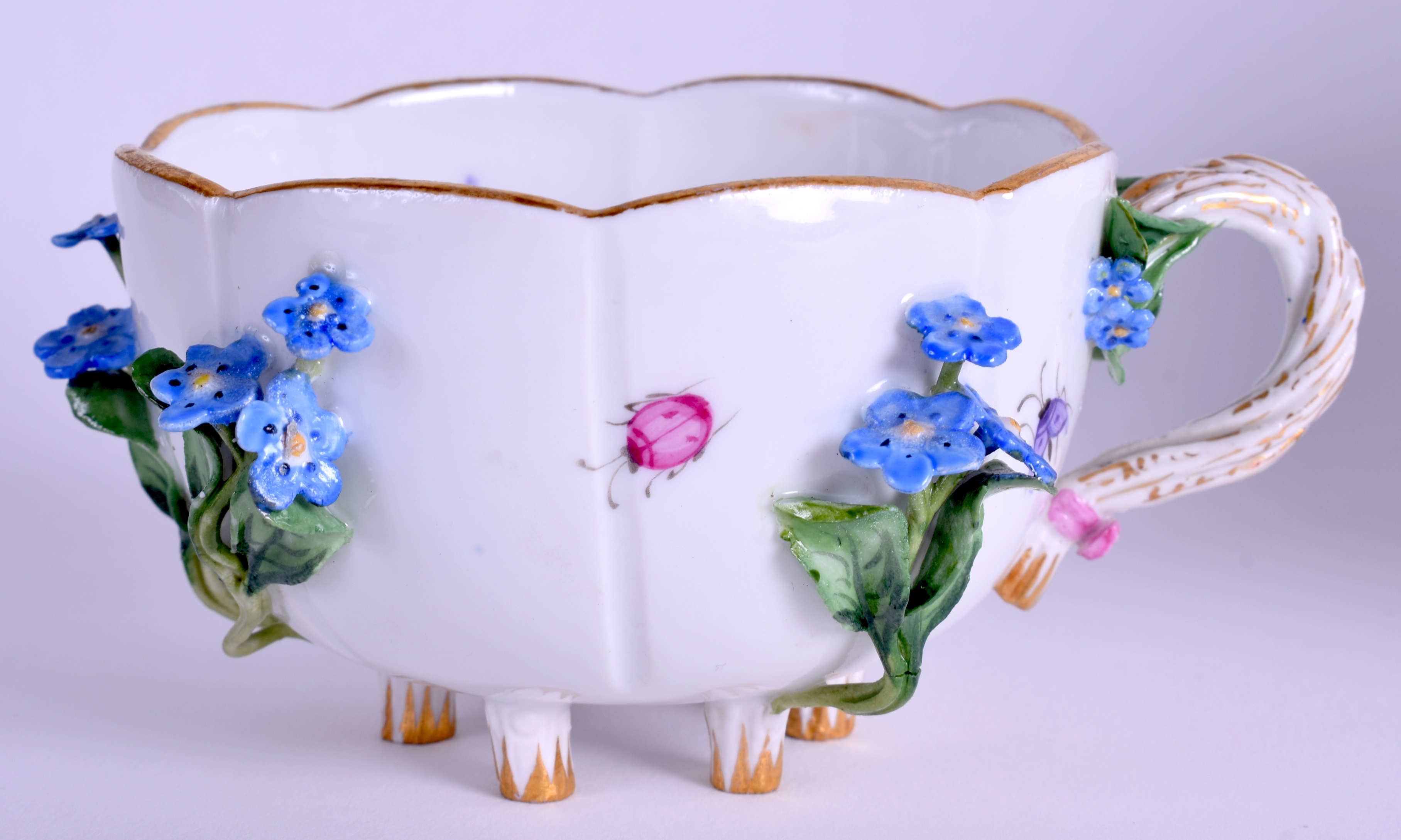 A MEISSEN ENCRUSTED PORCELAIN CUP AND SAUCER encrusted with flowers. (2) - Image 2 of 4