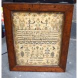 A 19TH CENTURY FRAMED SAMPLER, “Mary Ann Wheeler, aged 10 years 1943”. 41.5 cm x 33 cm.