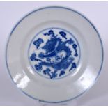 A CHINESE BLUE AND WHITE DISH GUANGXU MARK AND PERIOD, painted with a dragon in flight amongst the