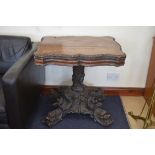 AN ANTIQUE ENGLISH OAK TABLE, boldly carved with fish and foliage. 77 cm x 77 cm.