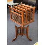 A MOORISH STYLE WOODEN REVOLVING MAGAZINE RACK, formed with spherical beaded fencing. 73 cm x 33 cm