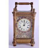 A LATE 19TH CENTURY FRENCH BRASS AND CHAMPLEVÉ ENAMEL CARRIAGE CLOCK the dial embellished with scro