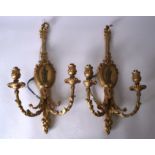 A PAIR OF 19TH CENTURY GILTWOOD DOUBLE BRANCH WALL SCONCE CANDLESTICK HOLDERS, decorated in relief