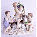A 19TH CENTURY MEISSEN PORCELAIN FIGURE OF FOUR CHILDREN modelled seated upon a recumbent deer. 18