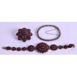 A 19TH CENTURY GARNET BROOCH, together with a bangle and a bracelet. (3)