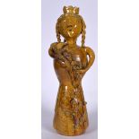 AN UNUSUAL LARGE YELLOW GLAZED POTTERY ROYAL FIGURE OR STATUE, formed standing in foliate engraved