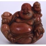 A CHINESE CARVED SOAPSTONE SEAL, the the form of a jovial buddha with a child upon his back. 8 cm x