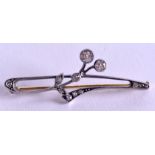 AN ANTIQUE DIAMOND INSET BROOCH, forming a floral sprig, approx ½ carat. 4.2 cm wide.