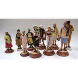 A COLLECTION OF TEN ANTIQUE INDIAN SCHOOL TERRACOTTA FIGURES OF TRADESMAN, formed in varying stance