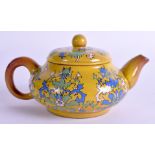 AN EARLY 20TH CENTURY CHINESE YELLOW ENAMELLED YIXING TEAPOT AND COVER painted with foliage. 13 cm