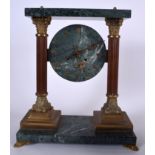 AN EARLY 20TH CENTURY MARBLE CLOCK, formed with wooden reeded columns upon stepped brass plinths. 3