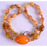 AN AMBER AND HORN TYPE NECKLACE. 58 cm total & weight 61 grams.