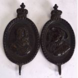 A PAIR OF JACOBETHAN REVIVAL CAST BRONZE PEG HOOKS, cast with oval portraits depicting monarchs. 10